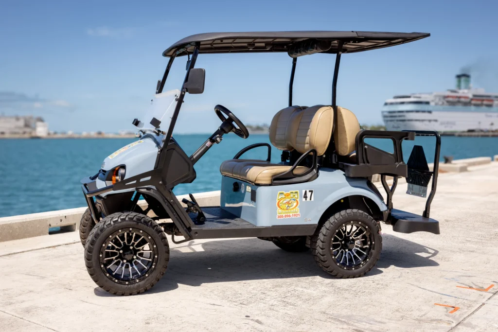 Four-seat electric cart rental Key West visitors use for a full day of island sightseeing