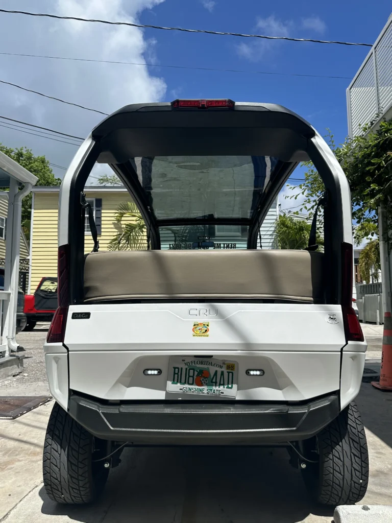 Key West golf cart rentals from A&M Rentals parked on a Key West street